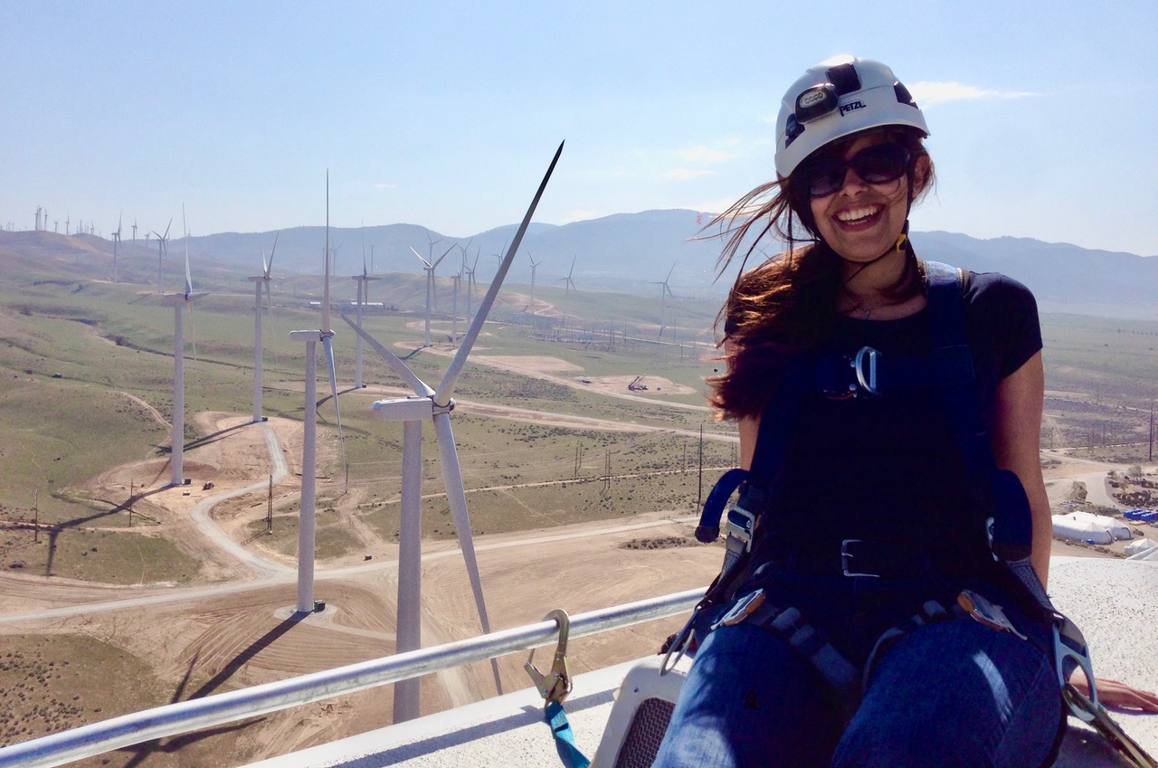 Veronica Barner in front of wind turbines